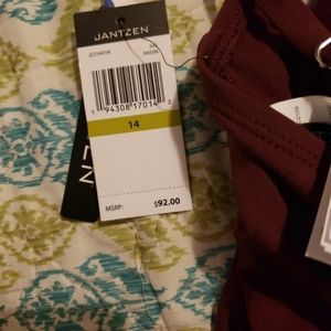 Jantzen burgundy swim suit, size 14. Never worn. Tags are still attached.